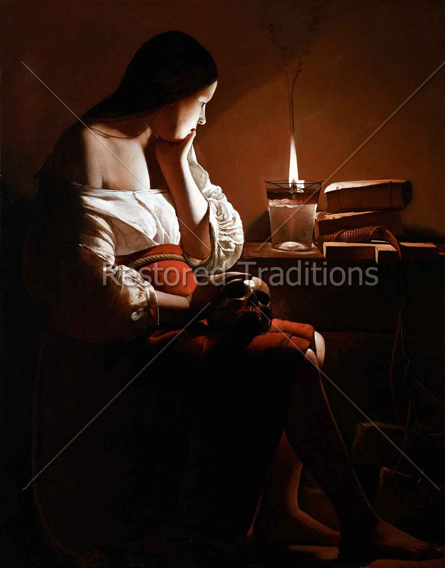 Woman sitting beside candle
